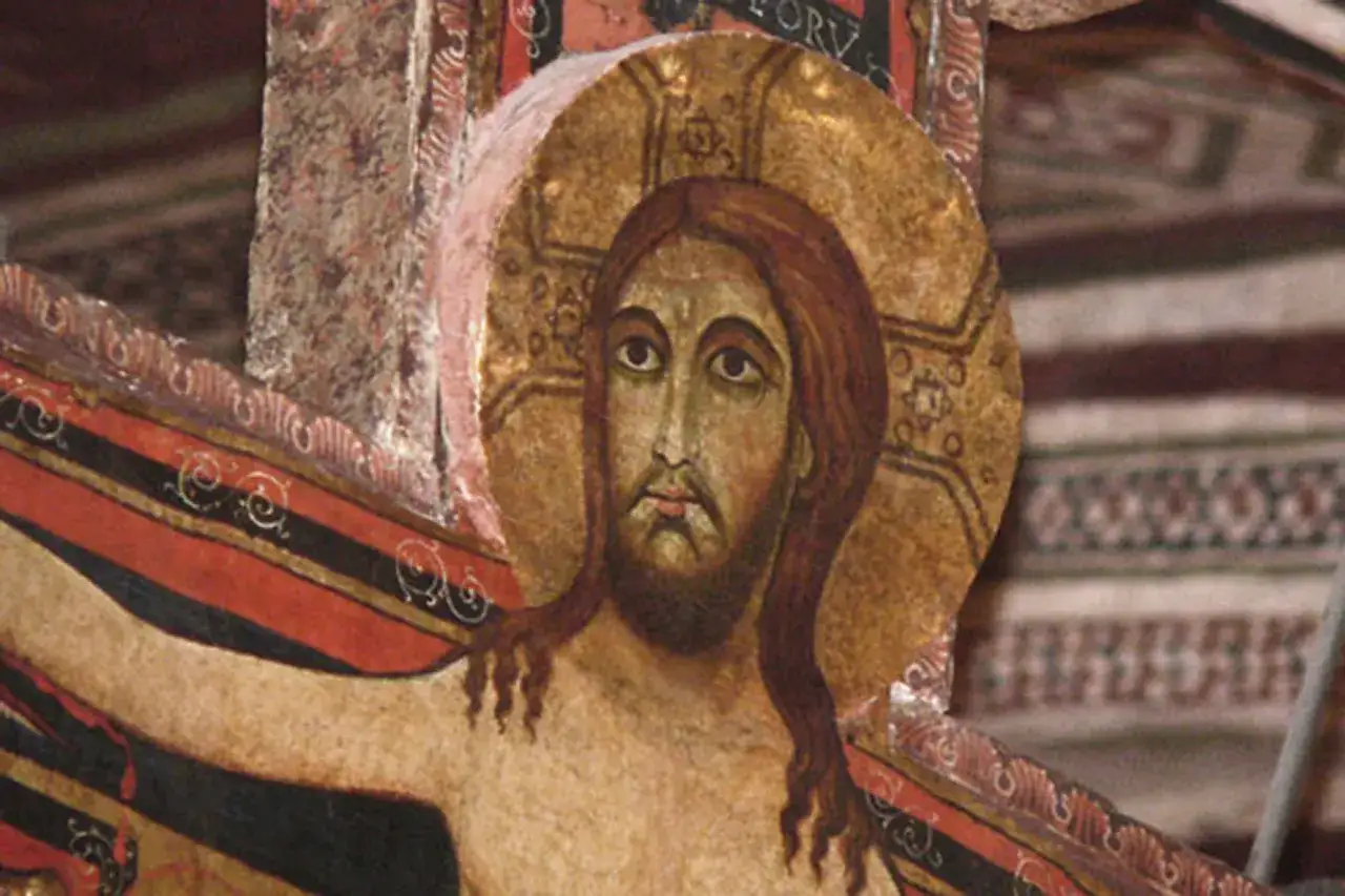 Detail eines alten Kruzifix-Gem&auml;ldes. Jesu Gesicht blickt nachdenklich, ein Symbol f&uuml;r das Kreuz Gebet.